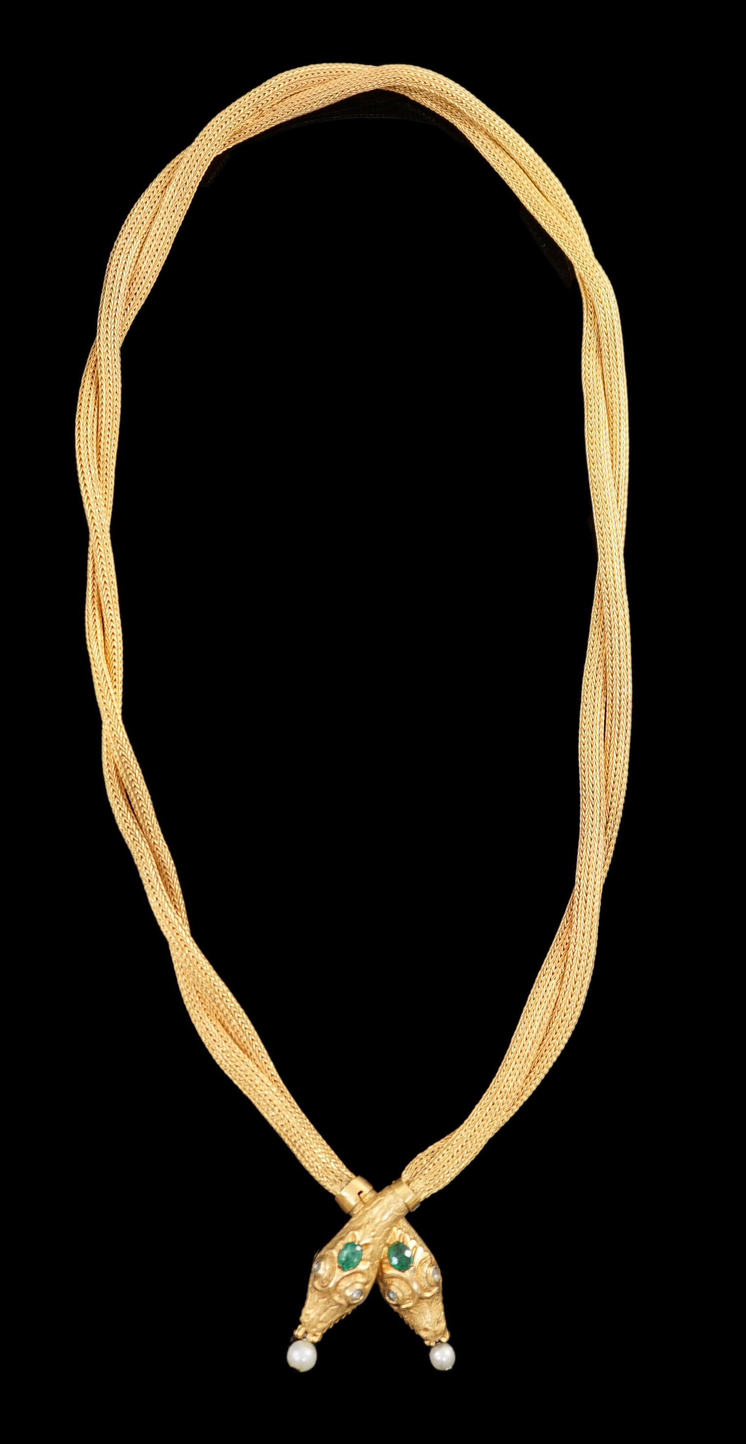 An early 20th century multi-strand gold, emerald, rose cut diamond and cultured pearl drop set twin headed serpent necklace